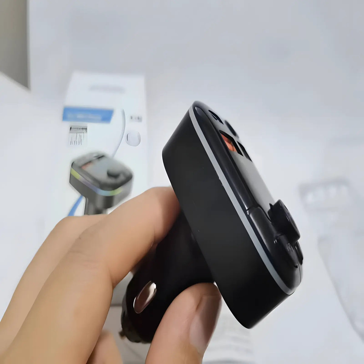 Jhonnyshop Bluetooth FM transmitter connects to car audio, features a digital display and USB charging port for wireless music streaming.
