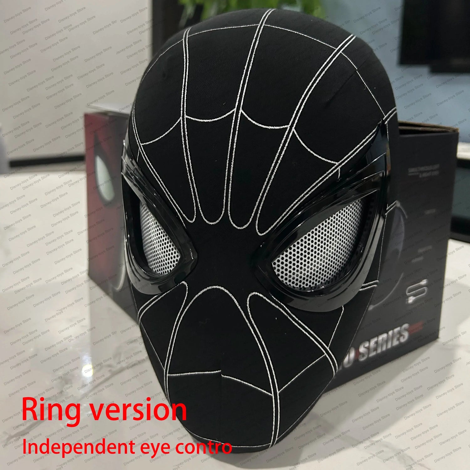 Black Spider Mask with white web pattern and mesh eye coverings, branded Jhonnyshop, displayed on a box.